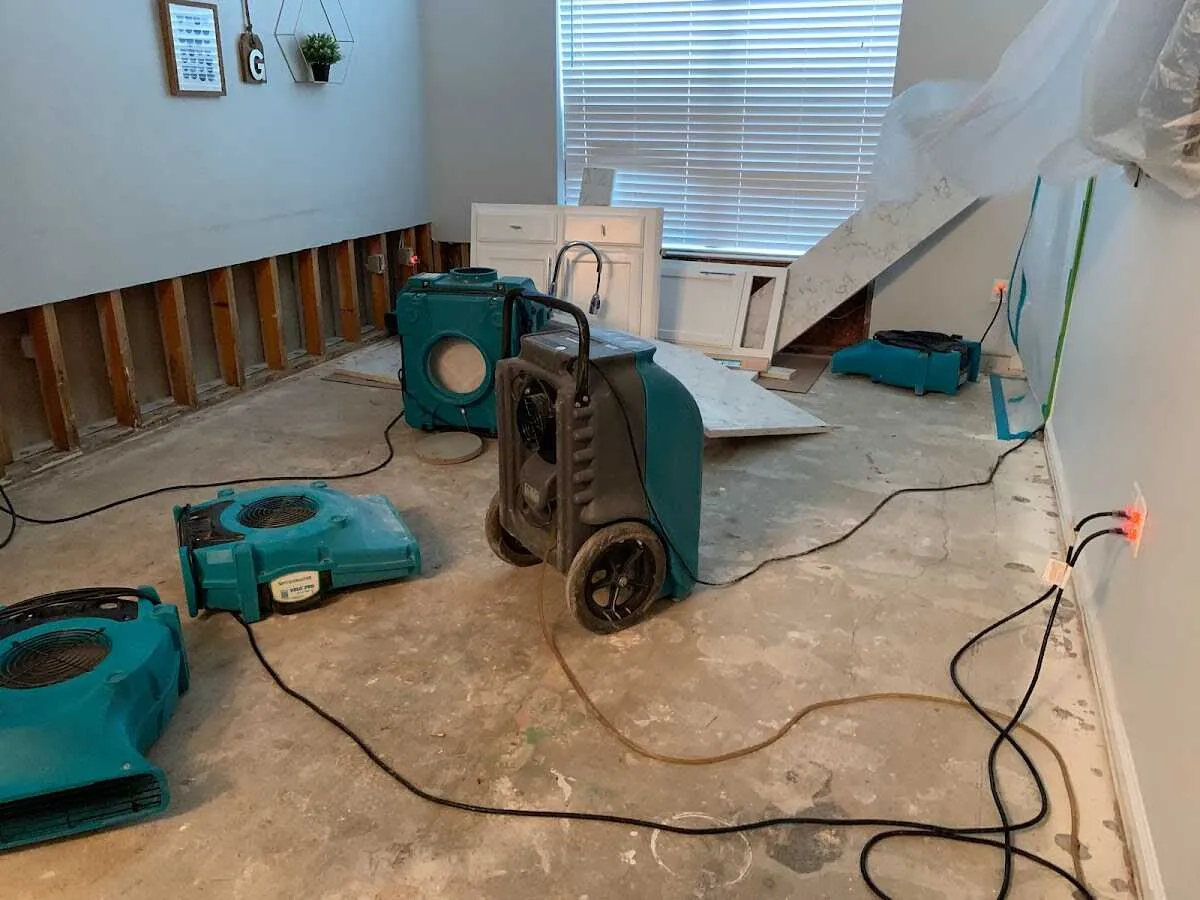 Dehumidifier in flood-cut room for Water Damage Restoration in Rindge